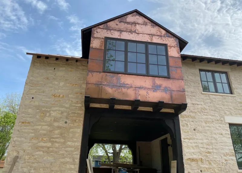 Copper metal panel facade on a stone building for Skylight Installation in Taylor Mill